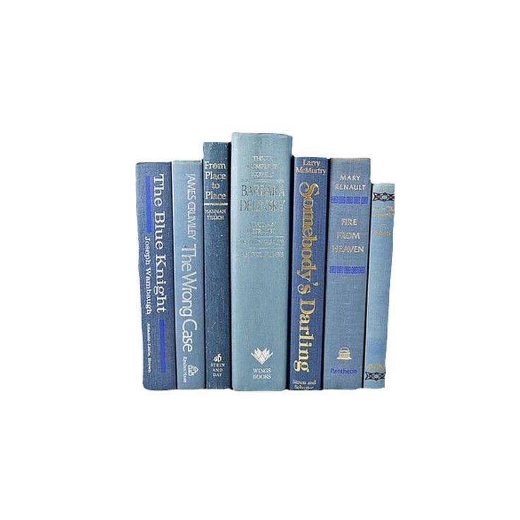 a row of blue books sitting on top of each other