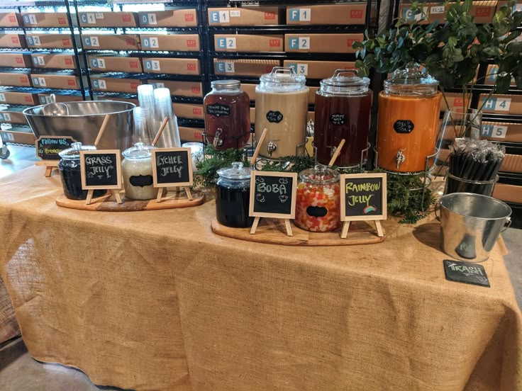 a table topped with lots of different types of food and drinks on top of it