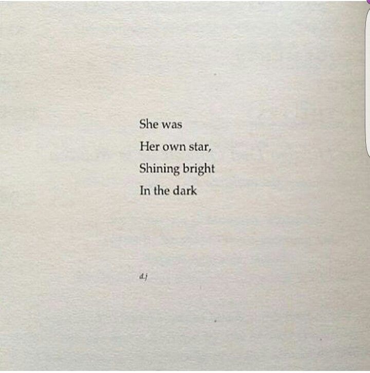 an old book with the words she was her own star, shining bright in the dark