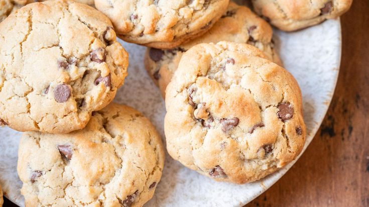 a plate full of chocolate chip cookies on a table