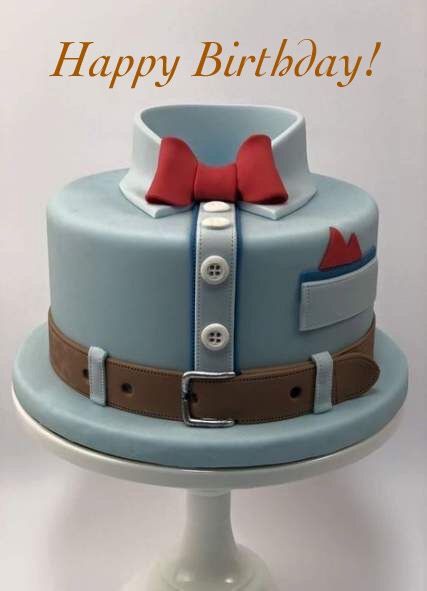 a blue and brown cake with a red bow tie on it's top is sitting on a white pedestal