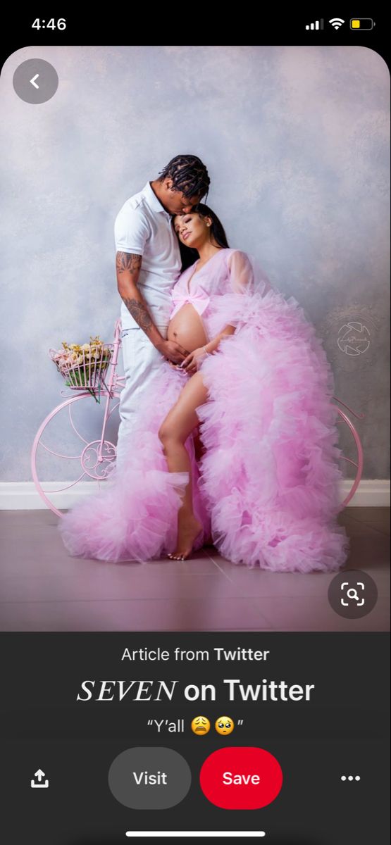 a man and woman posing for a photo in front of a wall with text that reads articles from twitter seven on twitter