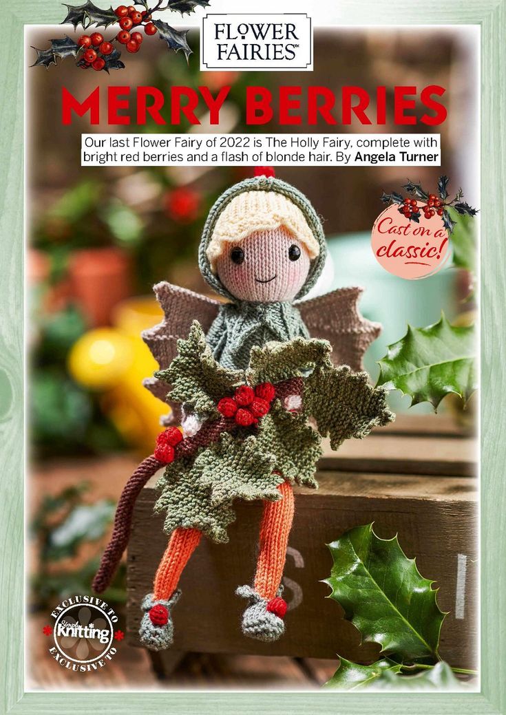 a knitted christmas doll with holly berries