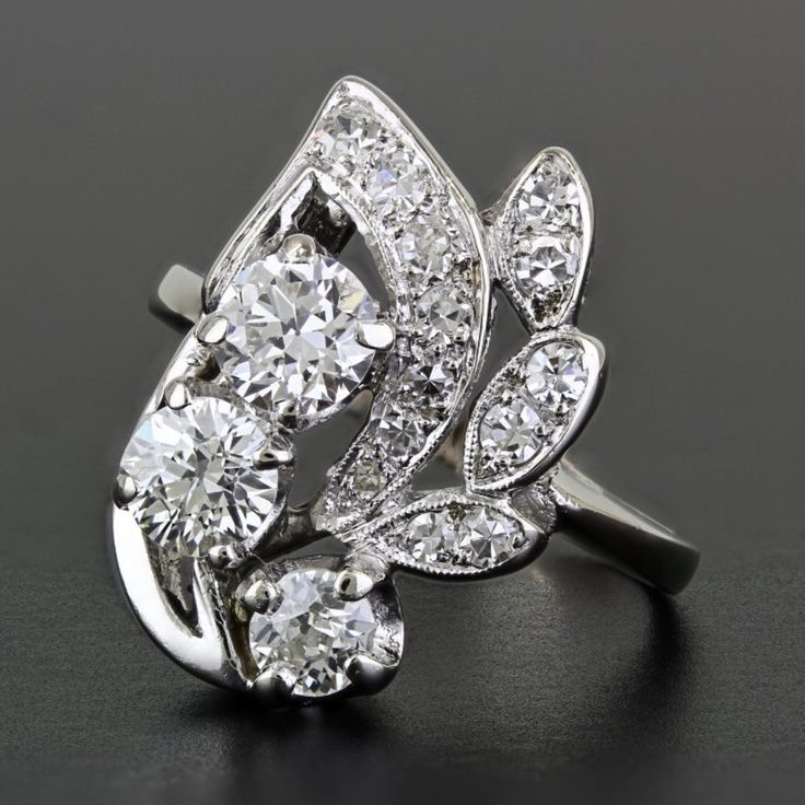 a ring with three diamonds on it