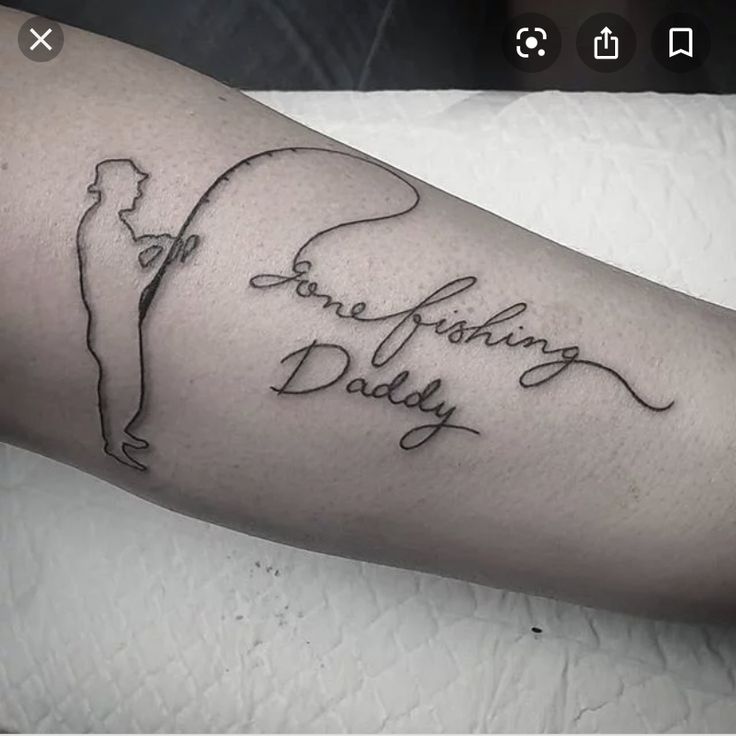 a person with a tattoo on their arm that says, one fishing daddy