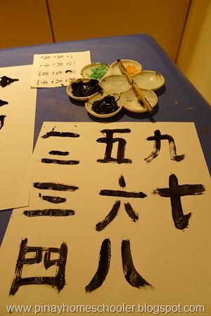 some chinese writing on a table with ink