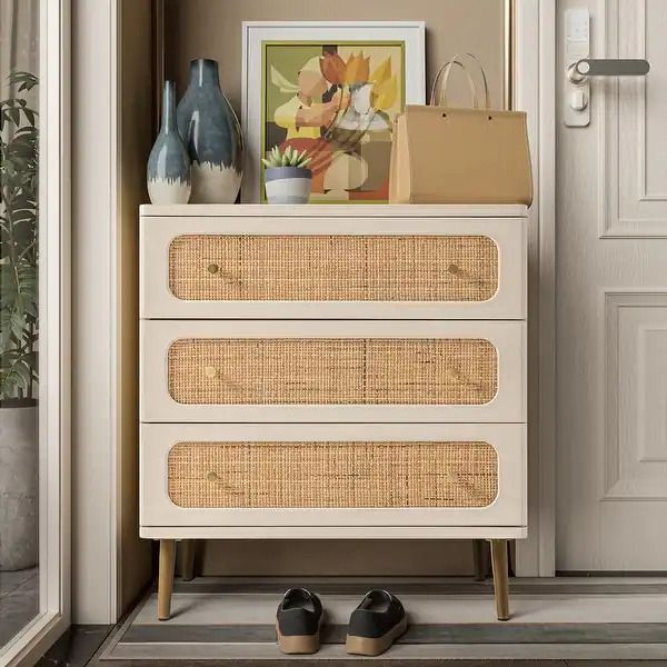 a white dresser with baskets and shoes on top