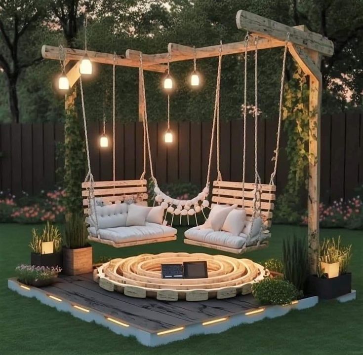 an outdoor swing bed with lights hanging from it's sides and pillows on the swings