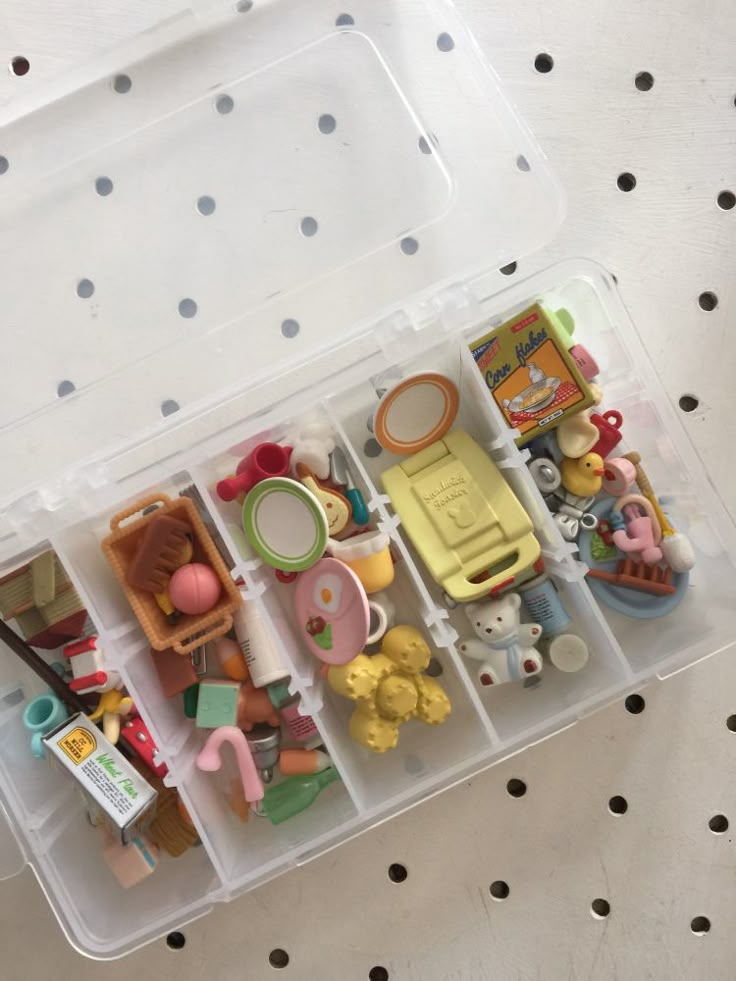 a plastic container filled with lots of toys