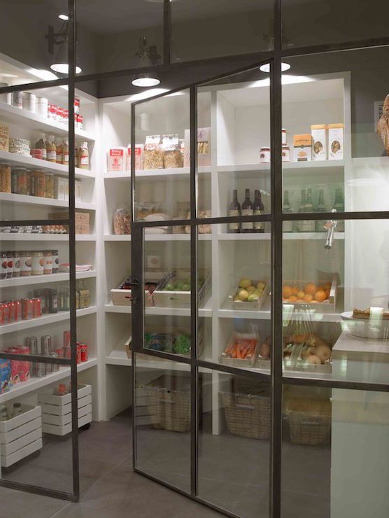 a store filled with lots of glass doors and shelves full of food on it's sides