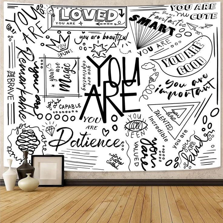 a wall mural with the words you are in black and white