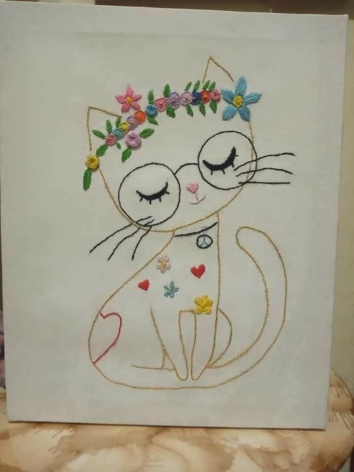 a white card with a cat and flower crown on it