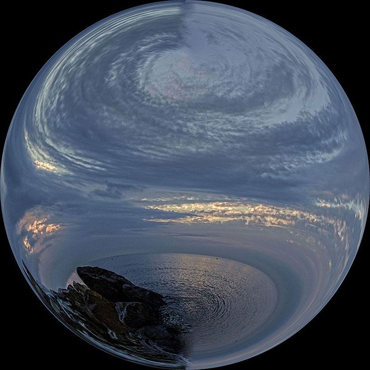 a fish eye view of the sky and water