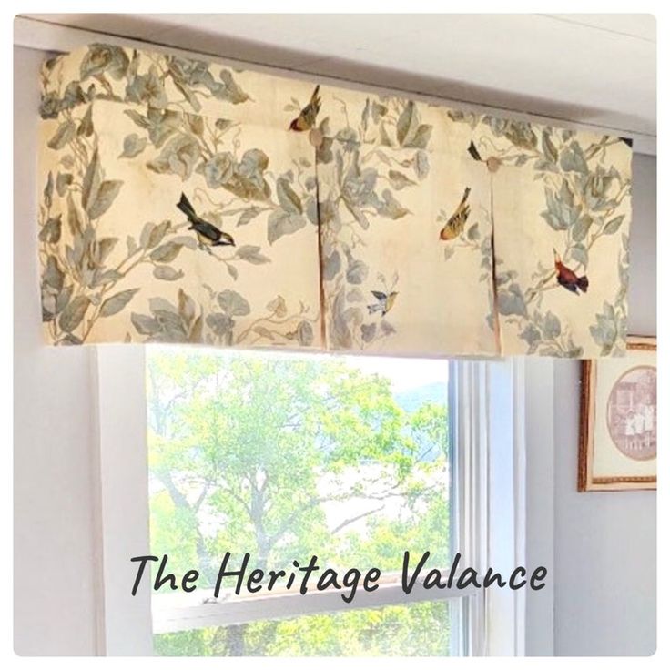 a kitchen window with birds on the valance