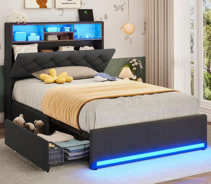 a bed with blue lights underneath it in a room