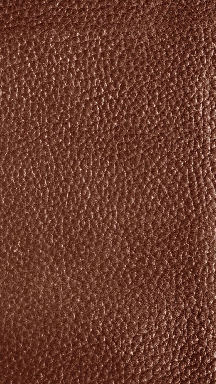 a brown leather texture background or textured upholstered with some sort of grain