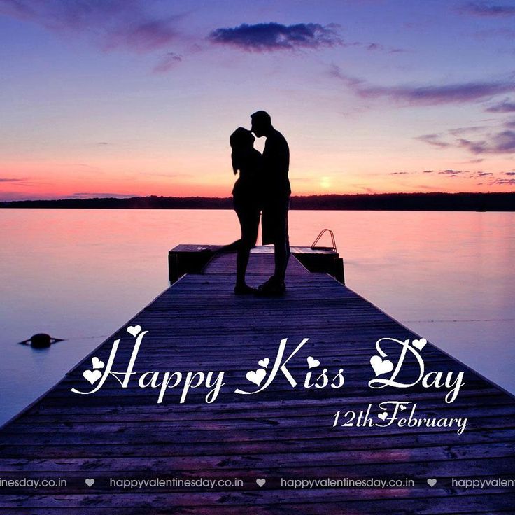 a couple kissing on the end of a pier at sunset with text happy kiss day