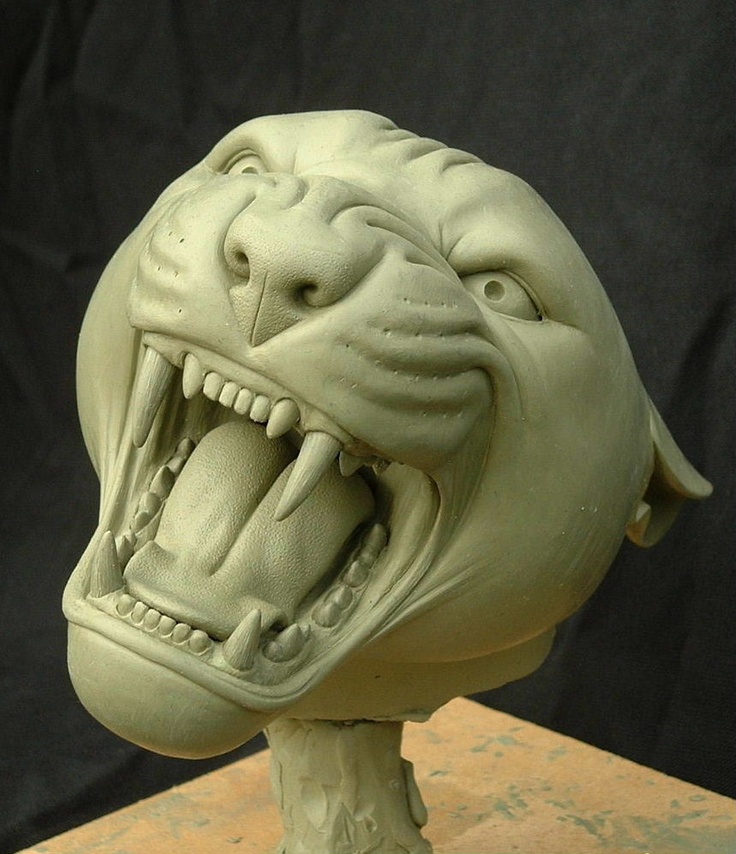 a sculpture of a dog's head with it's mouth open and teeth wide