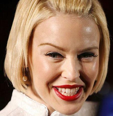 a close up of a person with a smile on their face and red lipstick in her mouth