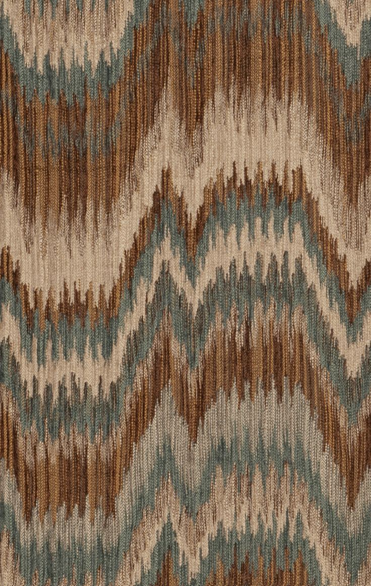 an abstract pattern with brown, blue and beige colors on fabric or upholster