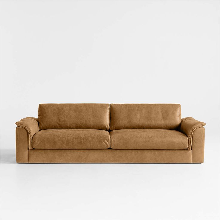 a brown leather couch against a white background