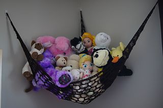 a hammock filled with lots of stuffed animals