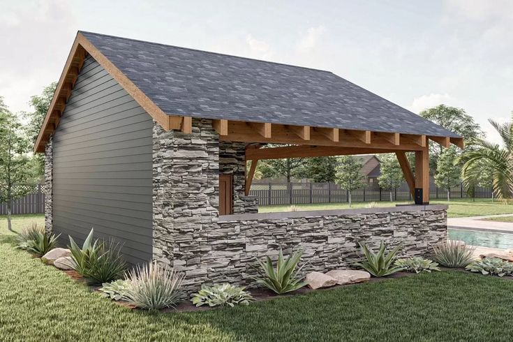 a small stone building with a pool in the background