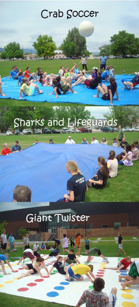 some people are sitting on the grass and one is playing with an inflatable ball