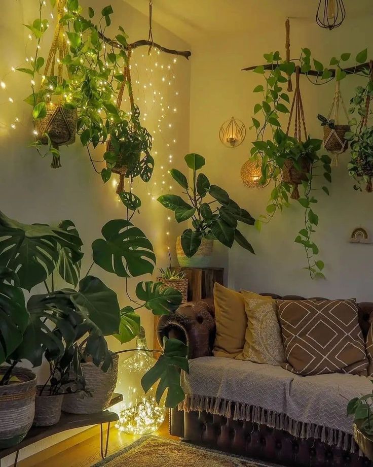 a living room filled with lots of plants and lights