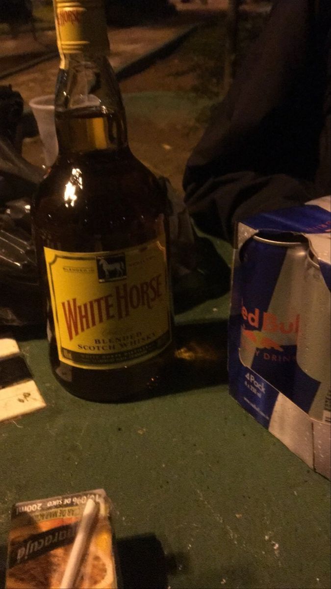 a bottle of beer sitting on top of a table