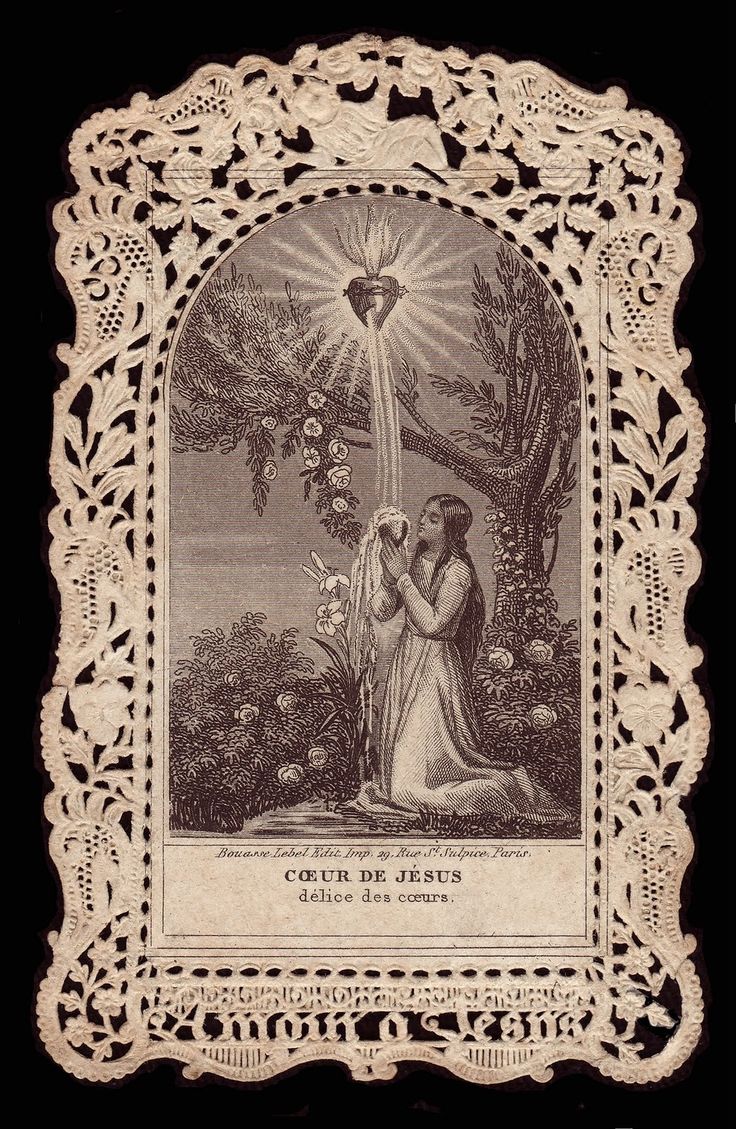 an old book with the image of jesus and mary