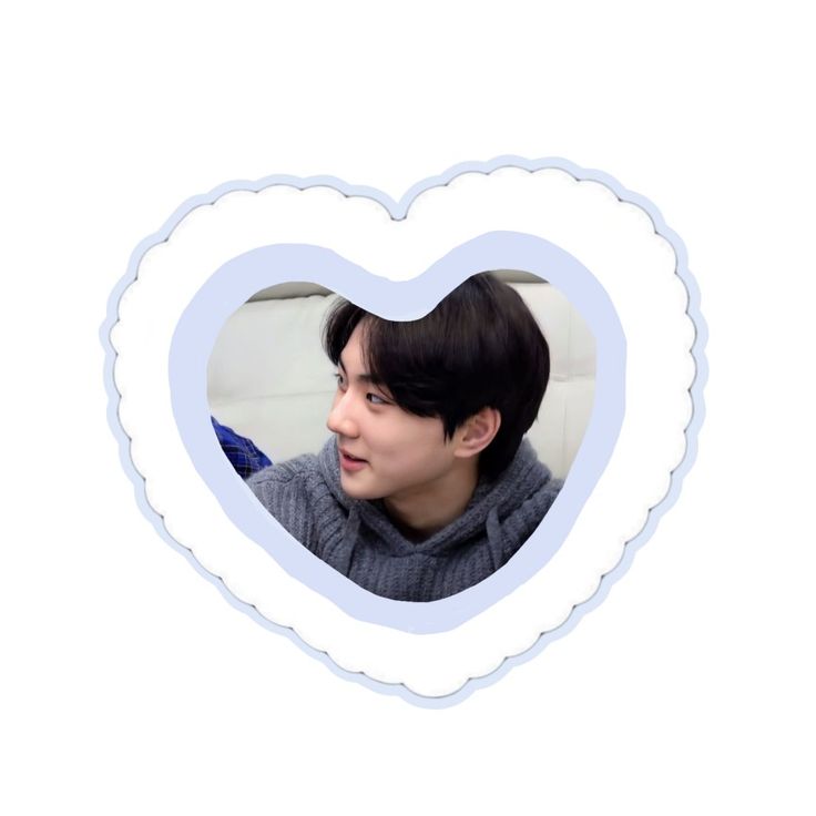 a heart shaped frame with a young man in it