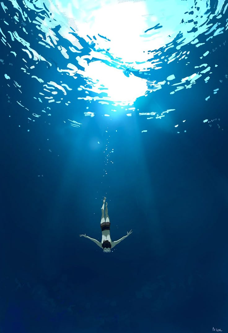 a woman swimming in the ocean under water