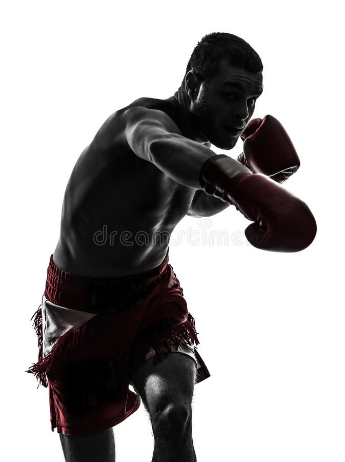 the silhouette of a man wearing boxing gloves