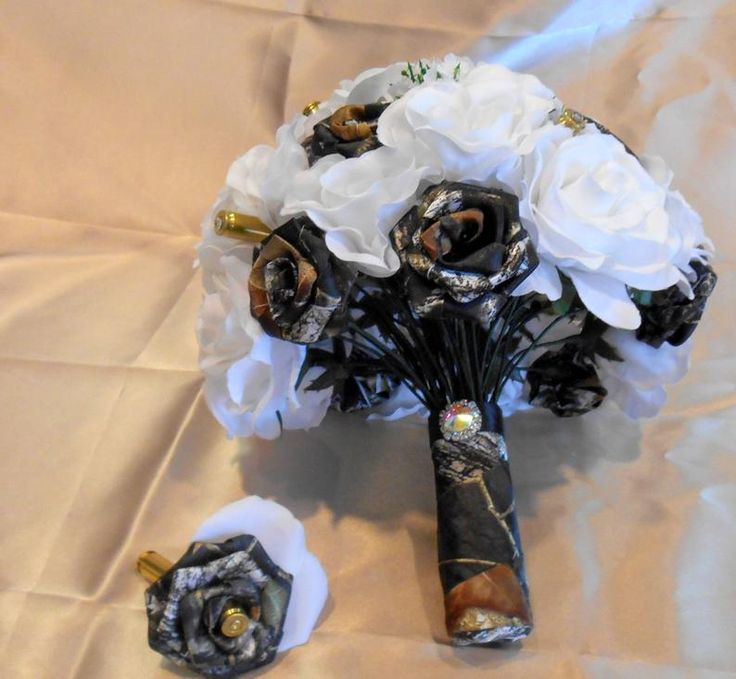 a bridal bouquet and boutonniers on a white sheet