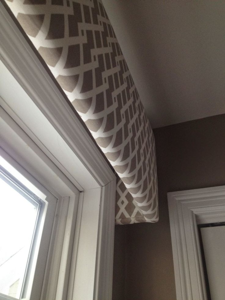 a window sill with a curtain hanging from it's side