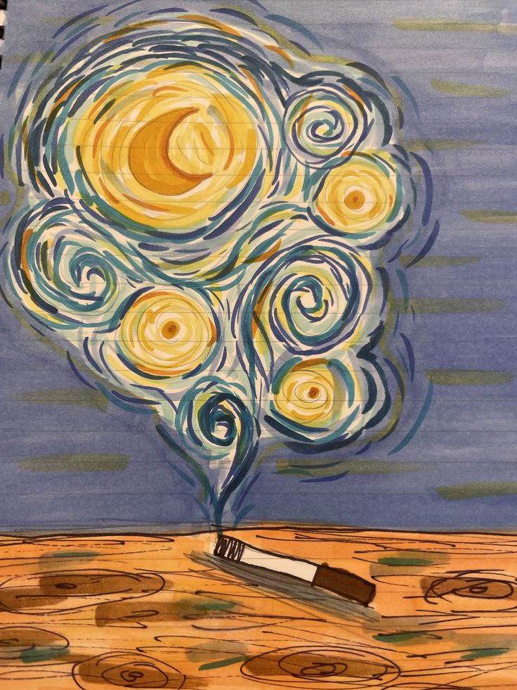 an artistic painting with a brush and swirls in the shape of a tree on top of a wooden table