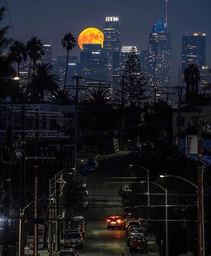 the full moon is seen over los angeles