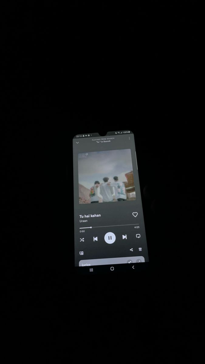 an mp3 player is shown in the dark