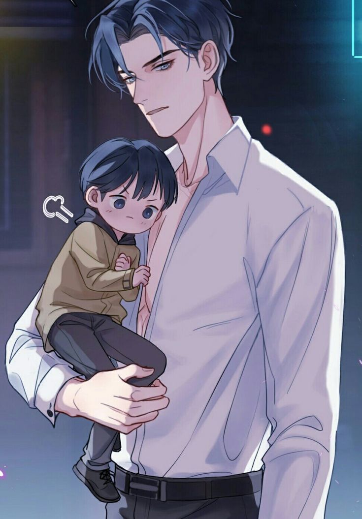 a man holding a small child in his arms