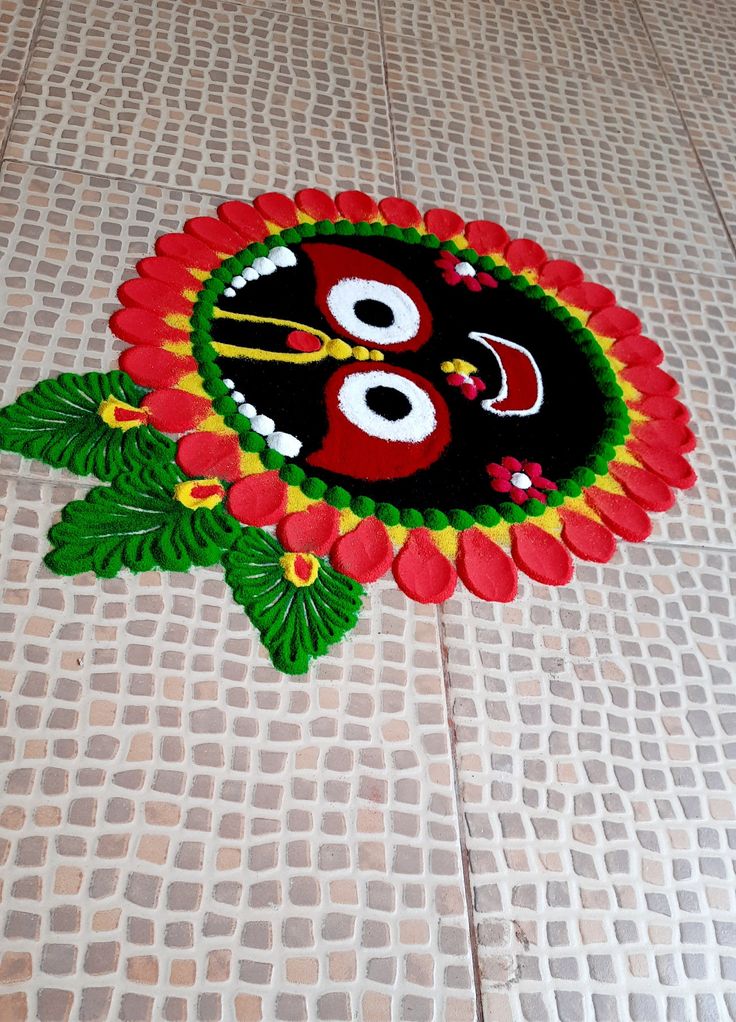 a decorated floor with an evil face on it