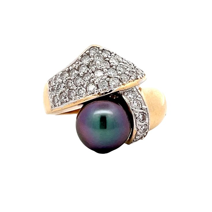 Diamond & Tahitian Pearl Cocktail Ring in 14k Gold This cocktail ring features a captivating round Tahitian pearl at its center, surrounded by a halo of pave diamonds with SI1-SI2 clarity and G color. The pearl sits on a bypass band in 14 karat yellow gold giving the ring a unique contrast of color. A striking piece that can transition effortlessly from day to night and adds just the right amount of brilliance and sophistication to any look. PRIMARY STONE Stone: Natural Diamond Shape: Round Diam Engagement Ring Style Guide, Ring Style Guide, Pearl Cocktail Ring, Jewelry Style Guide, Wedding Band Styles, Platinum Rose Gold, Sapphire Solitaire, Tahitian Pearls, Engagement Ring Styles