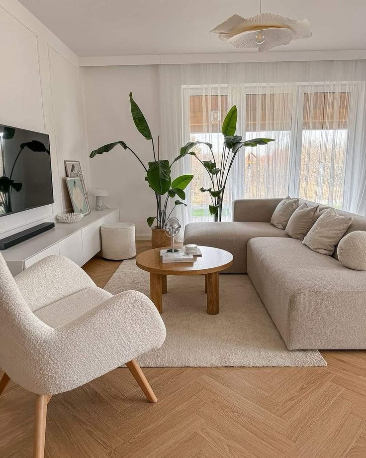 a living room filled with furniture and a flat screen tv