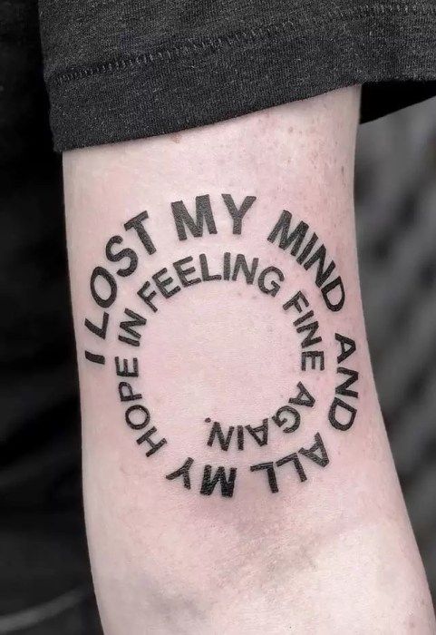 a person with a tattoo on their arm that says, lost my mind and hope