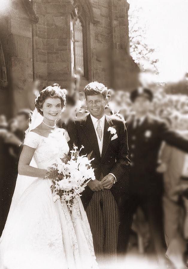 an old black and white photo of a bride and groom