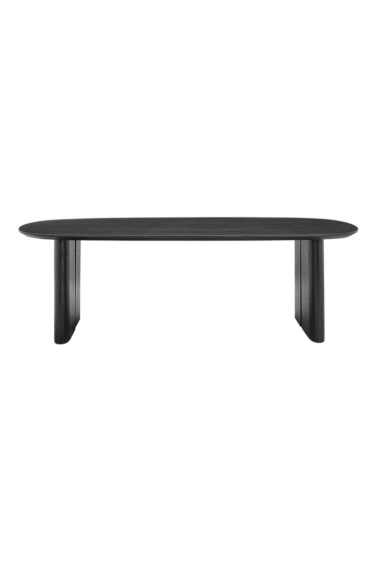 a black table sitting on top of a white wall