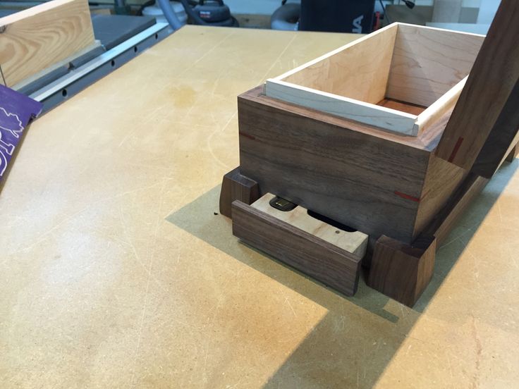 a wooden box sitting on top of a table