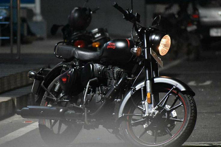 a black motorcycle parked on the side of the road