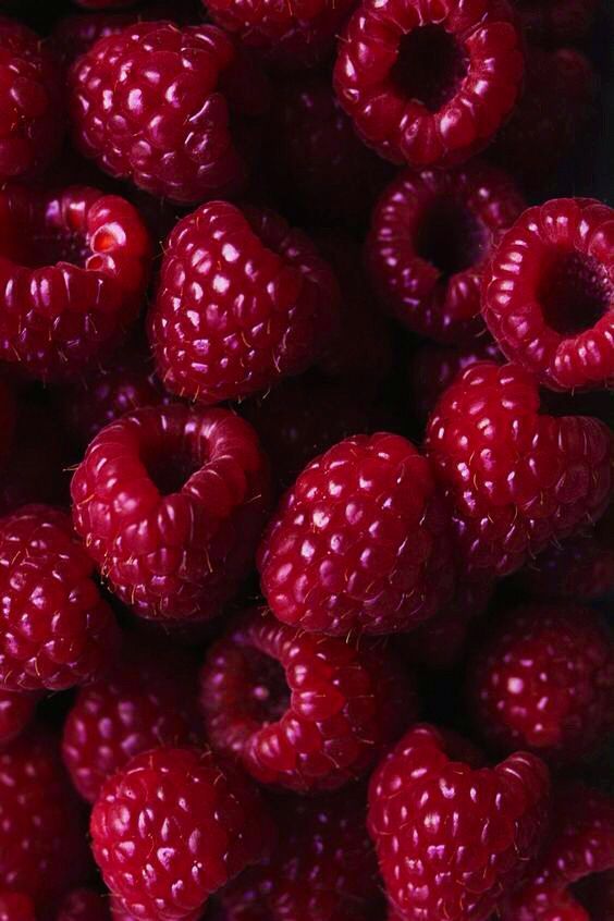 raspberries are piled up and ready to be eaten