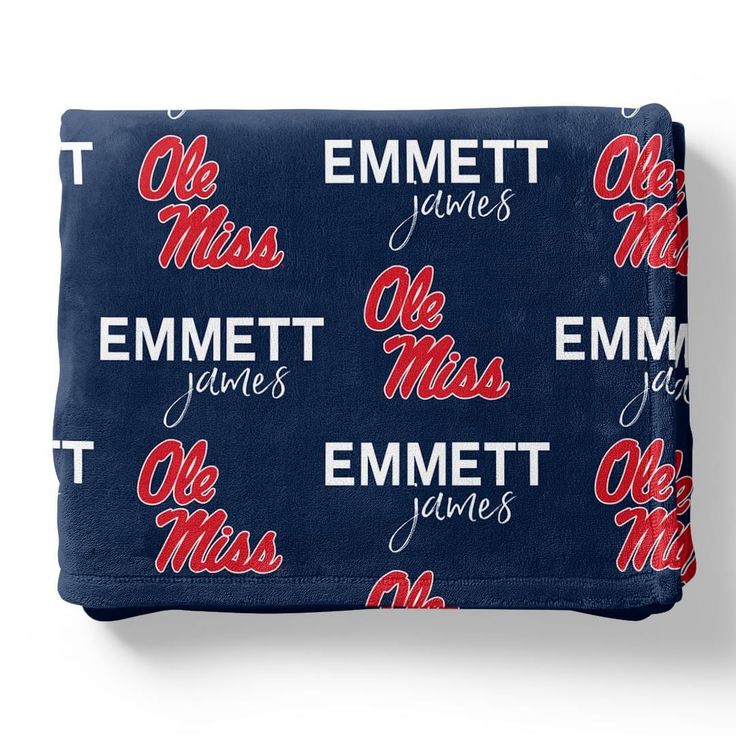 an image of a navy blue cosmetic bag with the words olem and mississippi on it